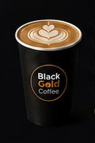 Black Gold Coffee latte with heart foam art.