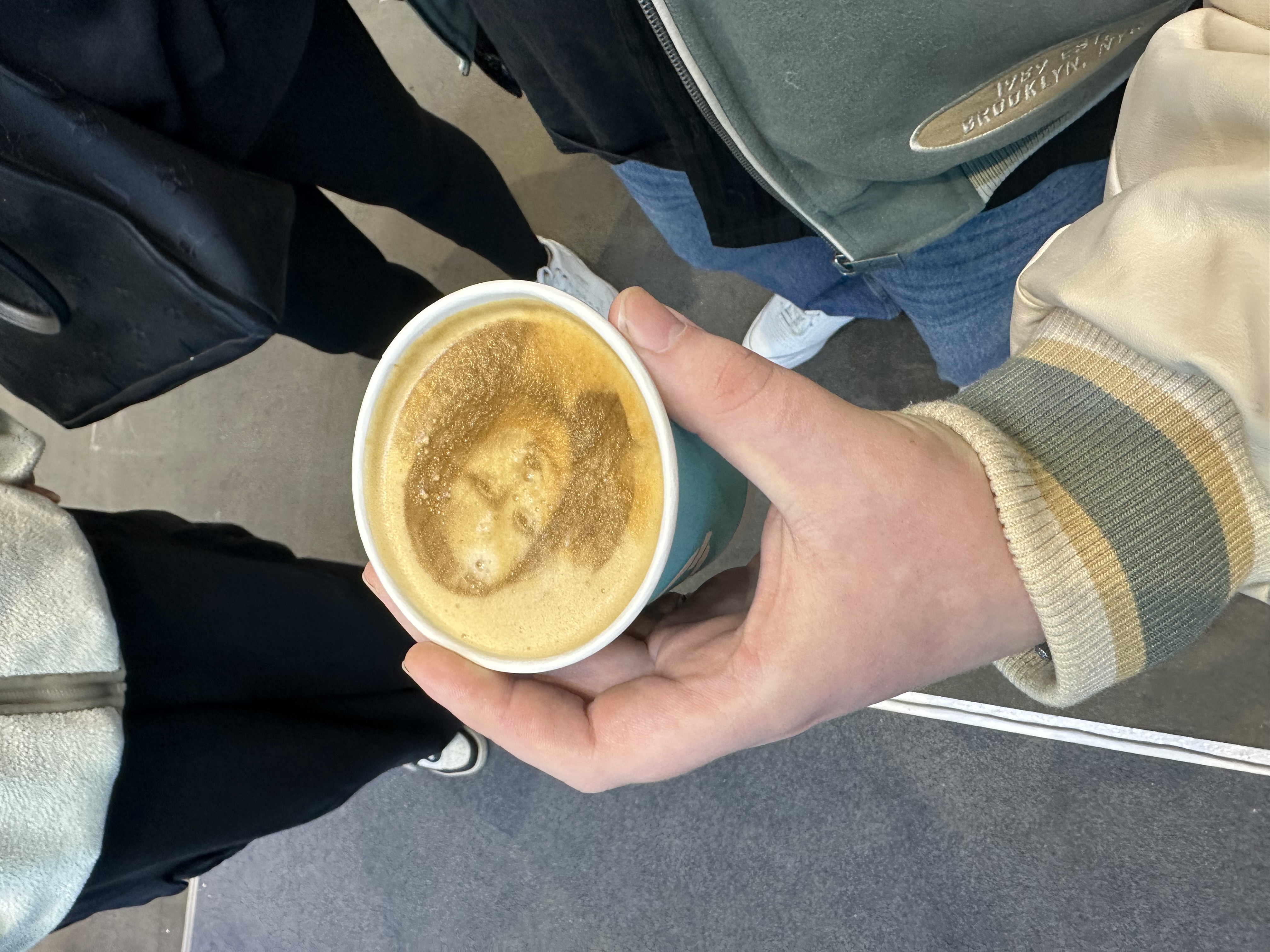 Portrait image printed onto coffee foam.